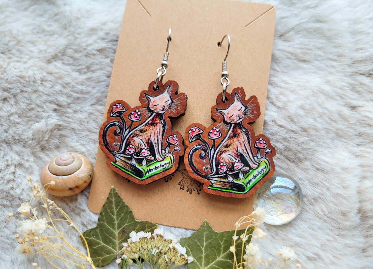 Bookworm Cat illustrated earrings, responsibly sourced cherry wood, 304 Stainless Steel hooks, by Grace Moth