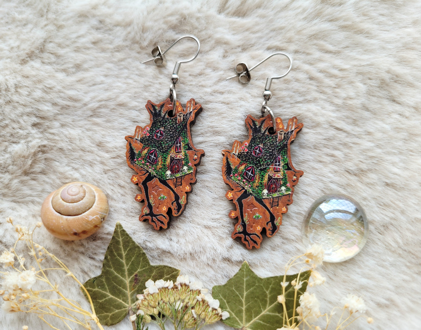 Baba Yaga witches hut illustrated earrings, responsibly sourced cherry wood, 304 Stainless Steel hooks, by Grace Moth