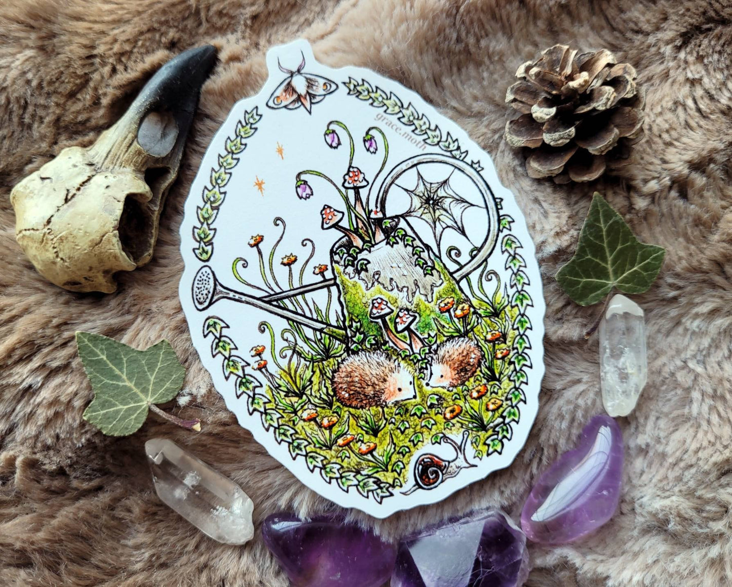 Magical Watering Can - Vinyl Sticker 10cm by 7cm - Illustrated by Grace moth. Hedgehogs, mushrooms, moss, ivy, garden, fantasy, cottage