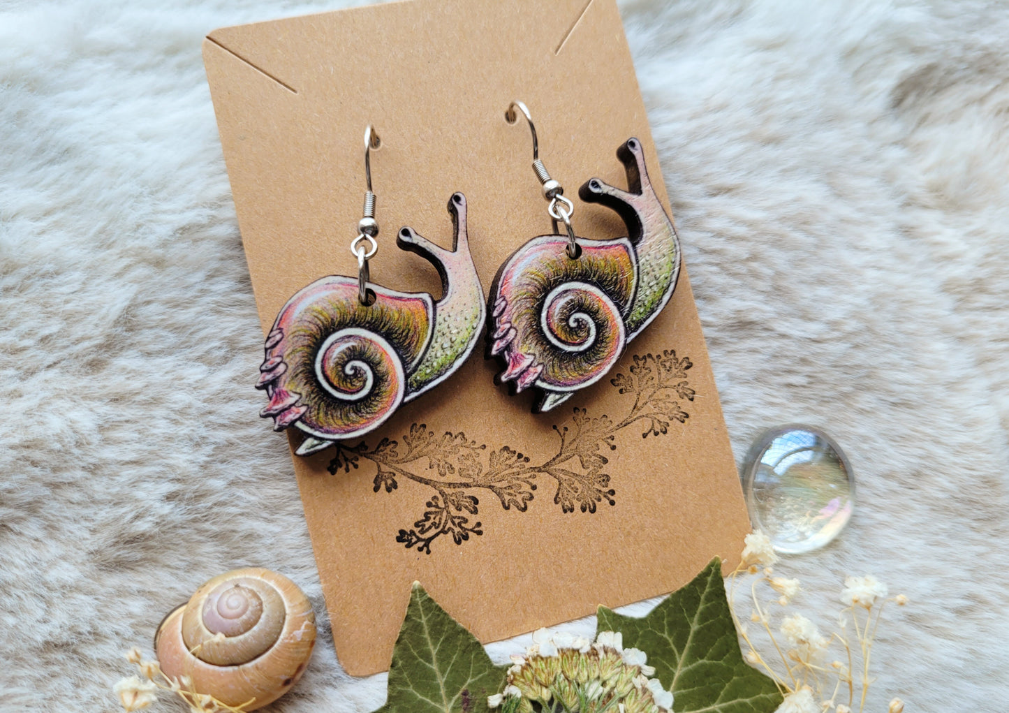 Cute Snail illustrated earrings, responsibly sourced cherry wood, 304 Stainless Steel hooks, by Grace Moth