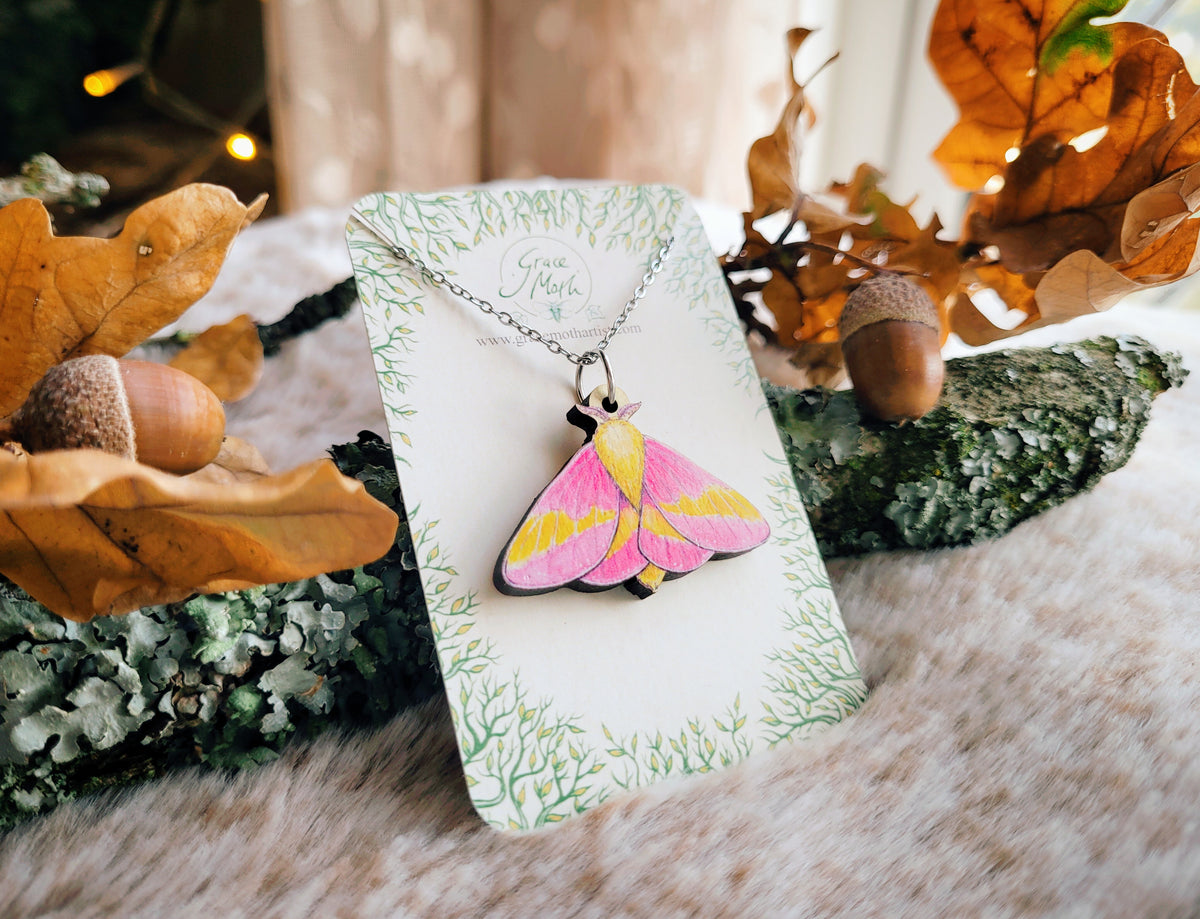 Rosy Maple Moth necklace, responsibly sourced cherry wood, pink watercolour entomology, by Grace Moth
