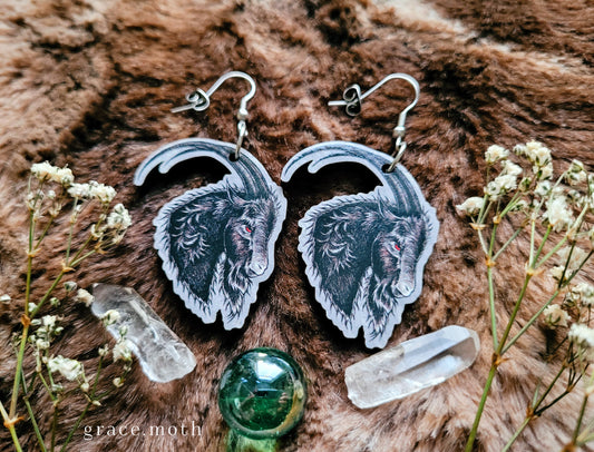 Black Phillip Goat illustrated earrings, responsibly sourced cherry wood, 304 Stainless Steel hooks, by Grace Moth
