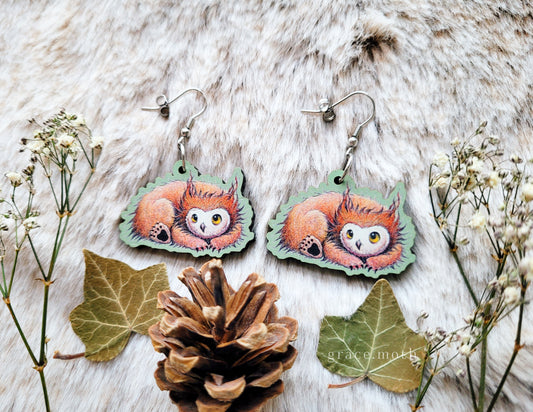 Owlbear Cub illustrated earrings, responsibly sourced cherry wood, 304 Stainless Steel hooks, by Grace Moth