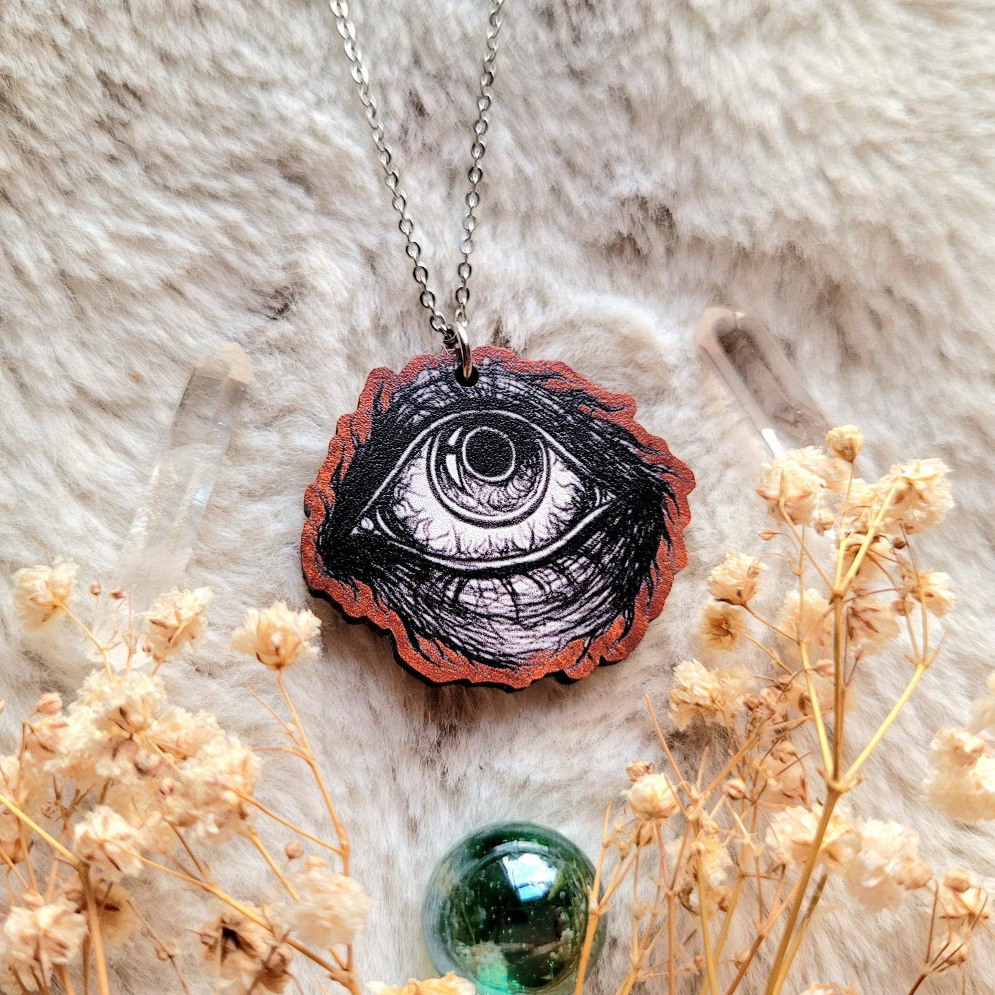 Creepy Eyeball illustrated necklace, responsibly sourced cherry wood, chain options available, by Grace Moth