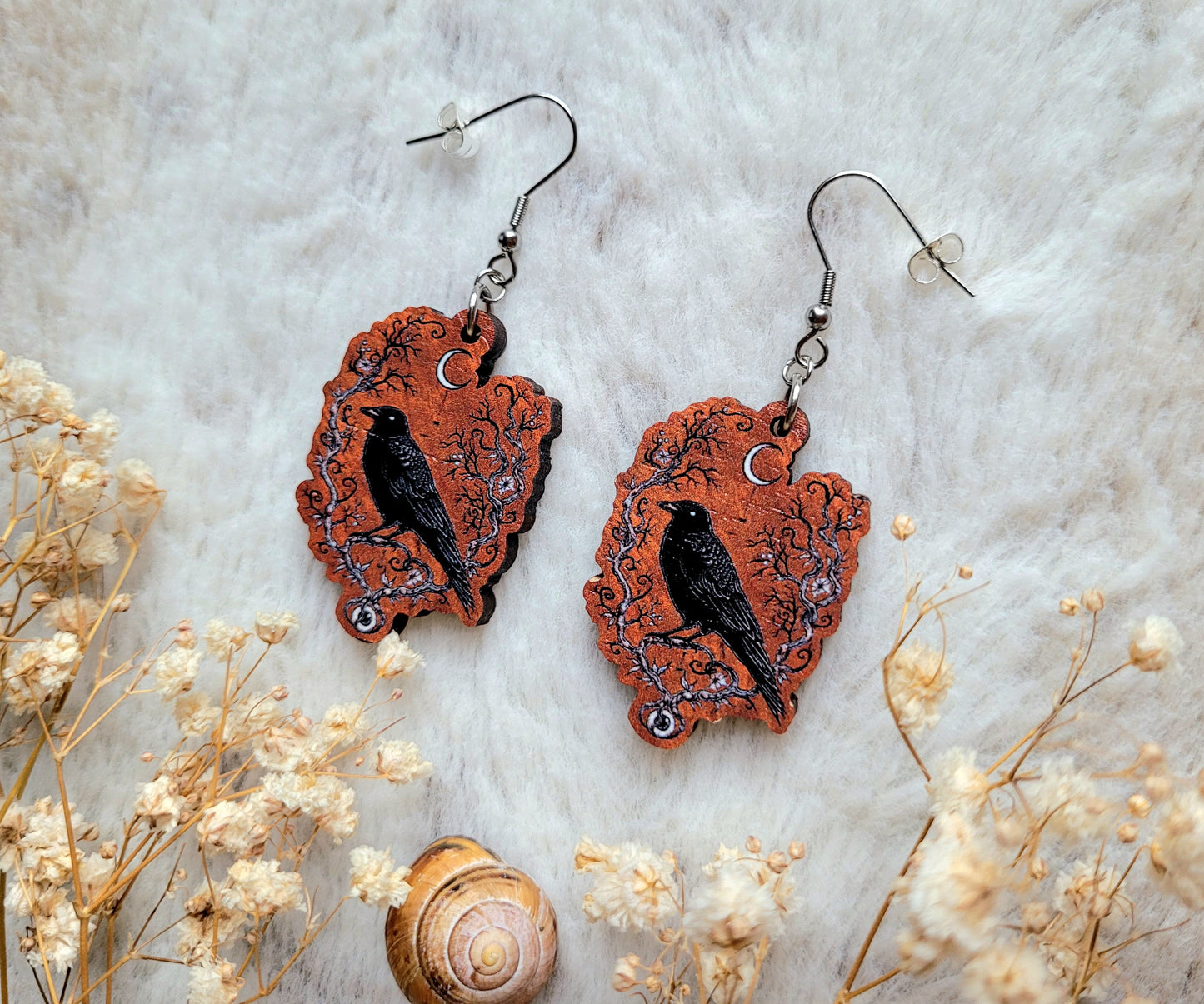 Crow Guardian illustrated earrings, responsibly sourced cherry wood, 304 Stainless Steel hooks, by Grace Moth