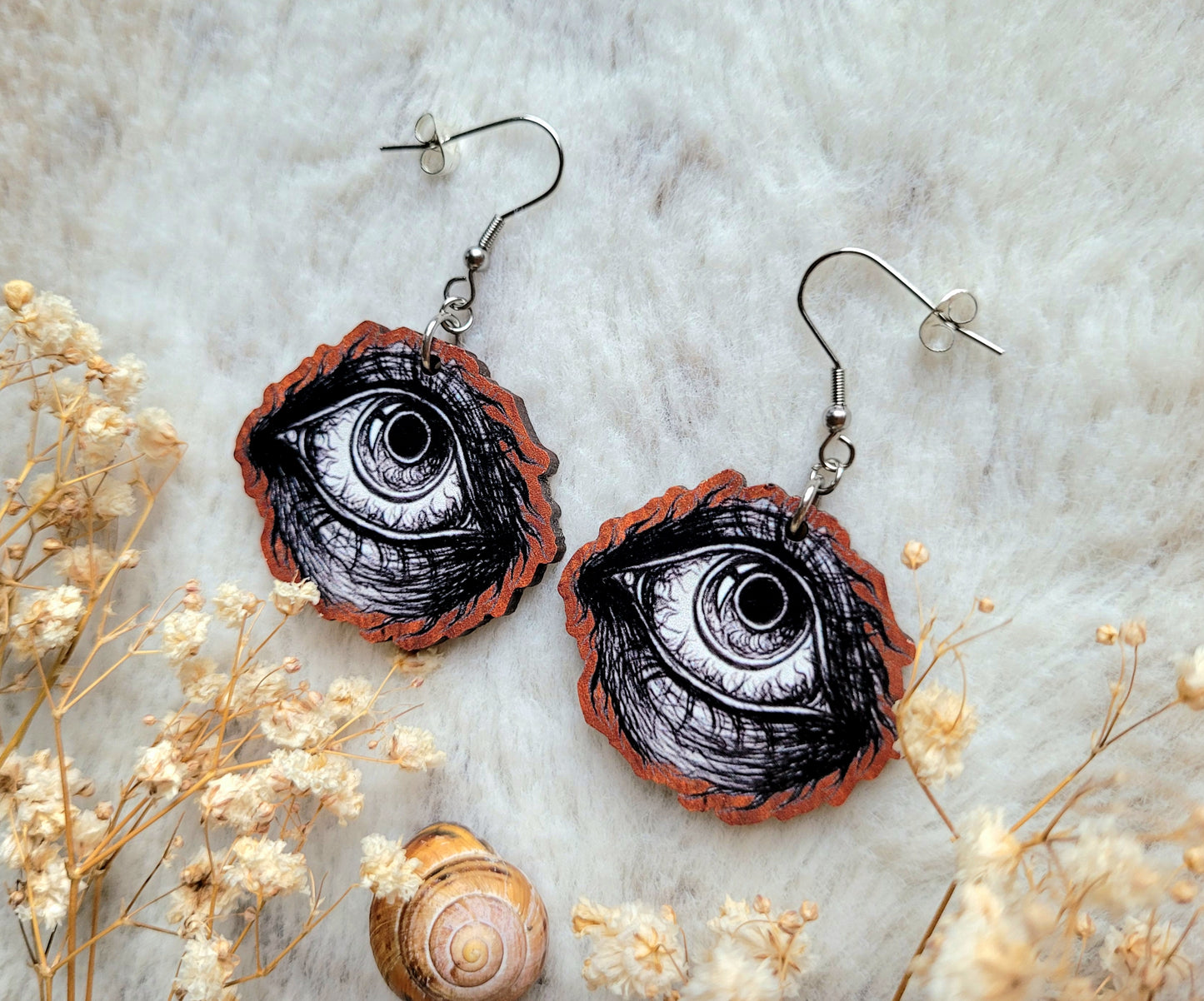 Creepy Eyeball illustrated earrings, responsibly sourced cherry wood, 304 Stainless Steel hooks, by Grace Moth