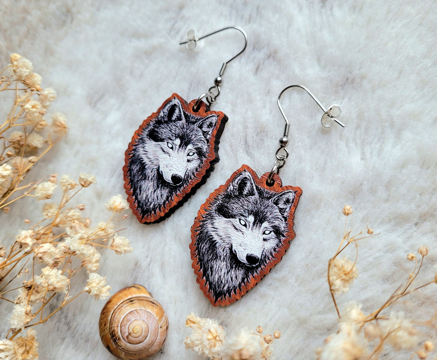 Wolf illustrated earrings, responsibly sourced cherry wood, 304 Stainless Steel hooks, by Grace Moth